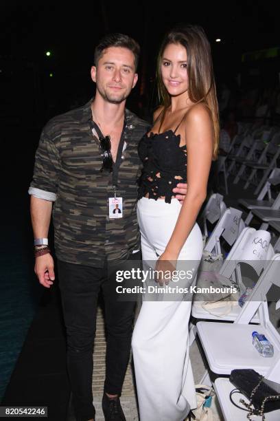 Vito Reznik and Jenna Crews attend the SWIMMIAMI KAOHS 2018 Collection fashion show at WET Deck at W South Beach on July 21, 2017 in Miami Beach,...