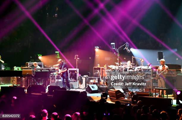 Page McConnell, Jon Fishman, Trey Anastasio and Mike Gordon of Phish perform at "The Baker's Dozen" Tour Kick-Off at Madison Square Garden on July...