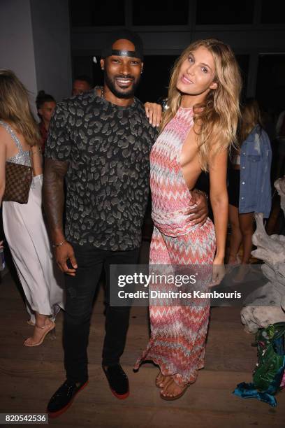 Tyson Beckford and model attend the SWIMMIAMI KAOHS 2018 Collection fashion show at WET Deck at W South Beach on July 21, 2017 in Miami Beach,...