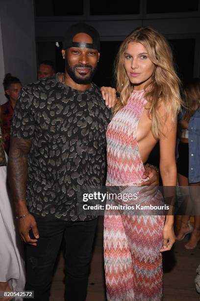 Tyson Beckford and model attend the SWIMMIAMI KAOHS 2018 Collection fashion show at WET Deck at W South Beach on July 21, 2017 in Miami Beach,...