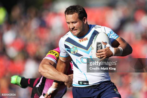 Tyrone Roberts of the Titans is tackled during the round 20 NRL match between the Penrith Panthers and the Gold Coast Titans at Pepper Stadium on...