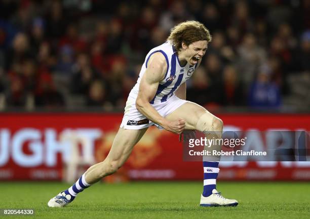 Ben Brown of the Kangaroos celebrates after scoring a goal during the round 18 AFL match between the Essendon Bombers and the North Melbourne...
