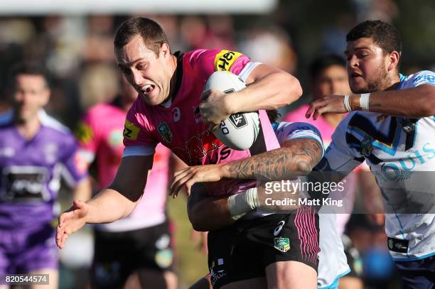 Isaah Yeo of the Panthers is tackled during the round 20 NRL match between the Penrith Panthers and the Gold Coast Titans at Pepper Stadium on July...