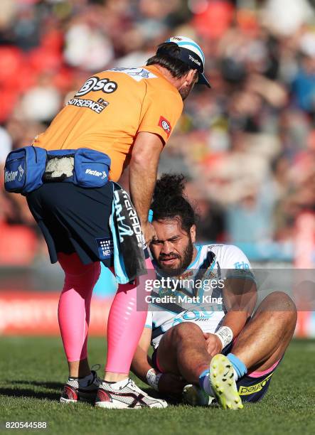 Konrad Hurrell of the Titans lies on the pitch injured during the round 20 NRL match between the Penrith Panthers and the Gold Coast Titans at Pepper...