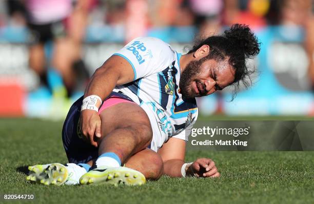 Konrad Hurrell of the Titans lies on the pitch injured during the round 20 NRL match between the Penrith Panthers and the Gold Coast Titans at Pepper...