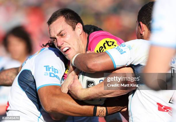 Isaah Yeo of the Panthers is tackled during the round 20 NRL match between the Penrith Panthers and the Gold Coast Titans at Pepper Stadium on July...