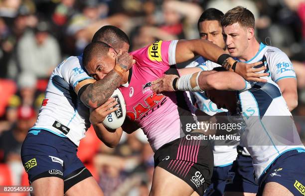 Leilani Latu of the Panthers is tackled during the round 20 NRL match between the Penrith Panthers and the Gold Coast Titans at Pepper Stadium on...