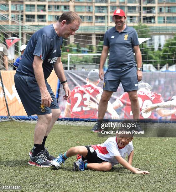 Child celebrating after scoring past Gary McAllister legend of Liverpool during a soccer school on July 22, 2017 in Hong Kong, Hong Kong.