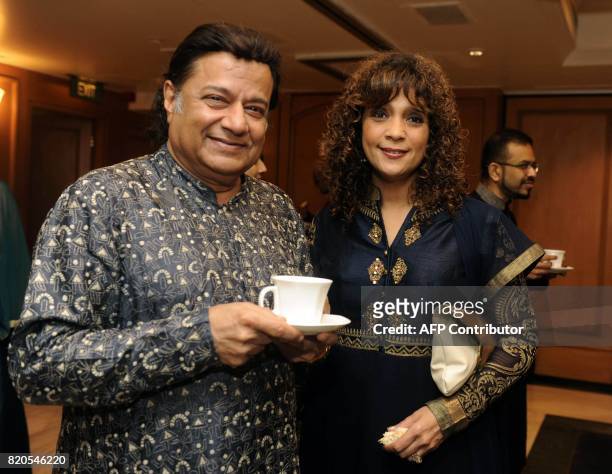 Indian Ghazal singers Anup Jalota and Penaz Masani attend the Ghazal music festival "Khazana", raising funds for cancer patients, in Mumbai on July...
