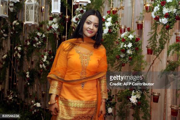 Indian singer Amruta Fadnavis attends the Ghazal music festival "Khazana", raising funds for cancer patients, in Mumbai on July 21, 2017. / AFP PHOTO...