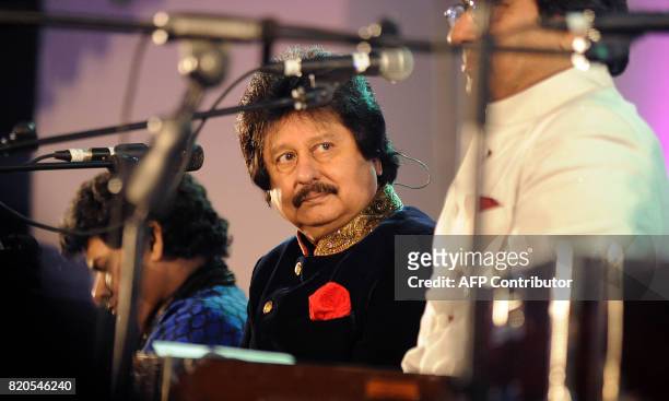 Indian Ghazal singer Pankaj Udhas attends the Ghazal music festival "Khazana", raising funds for cancer patients, in Mumbai on July 21, 2017. / AFP...