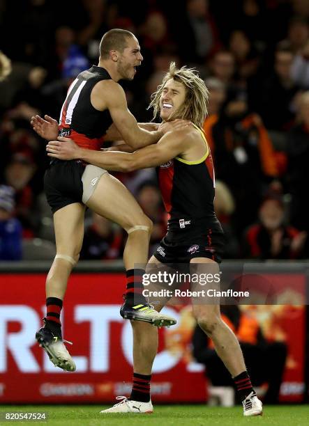 David Zaharakis of the Bombers celebrates with Dyson Heppell after scoring a goal during the round 18 AFL match between the Essendon Bombers and the...