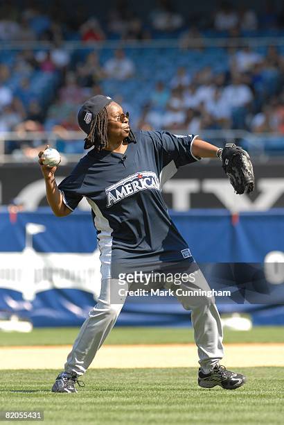 Whoopi Goldberg throws during the Taco Bell All-Star Legends & Celebrity Softball Game at the Yankee Stadium in the Bronx, New York on July 13, 2008.