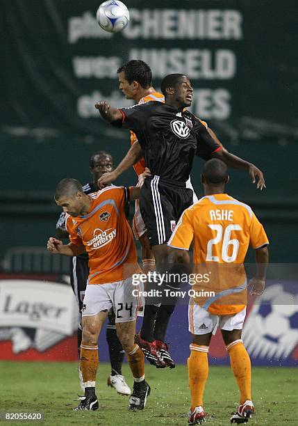 Quavas Kirk of D.C. United goes up for a header with Bobby Boswell of Houston Dynamo during the MLS match at RFK Stadium on July 23, 2008 in...