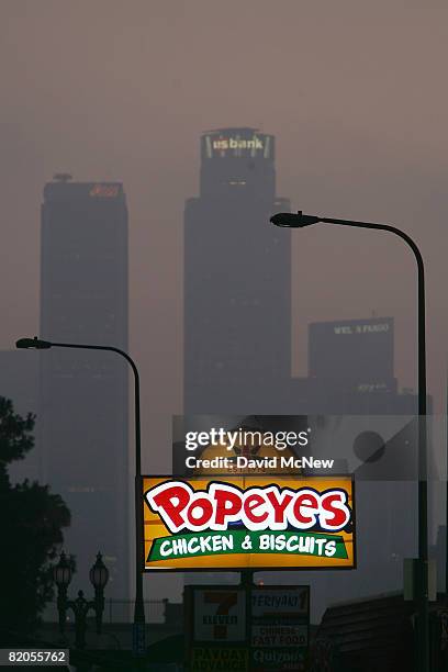 Popeyes fast-food restaurant sign glows above the Figueroa Corridor area of South Los Angeles on July 24 Los Angeles, California. The Los Angeles...