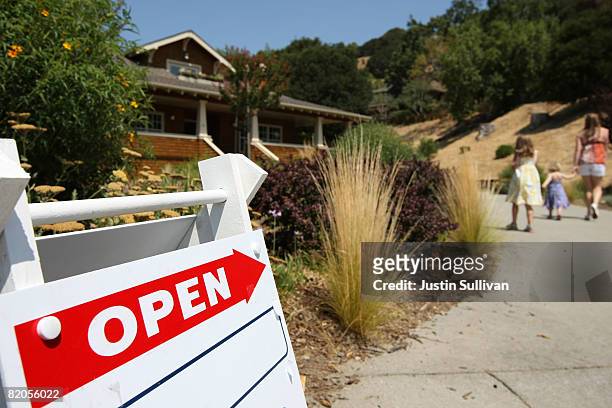 Sign advertising an open house is posted outside a home for sale July 24, 2008 in Fairfax, California. According to a report by The National...