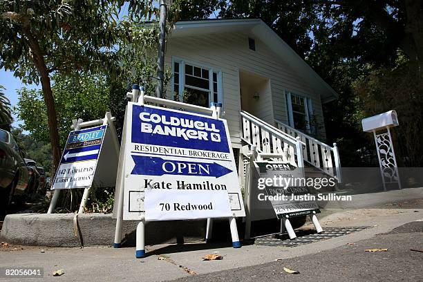 Signs advertising open homes are displayed on a street corner July 24, 2008 in Fairfax, California. According to a report by The National Association...