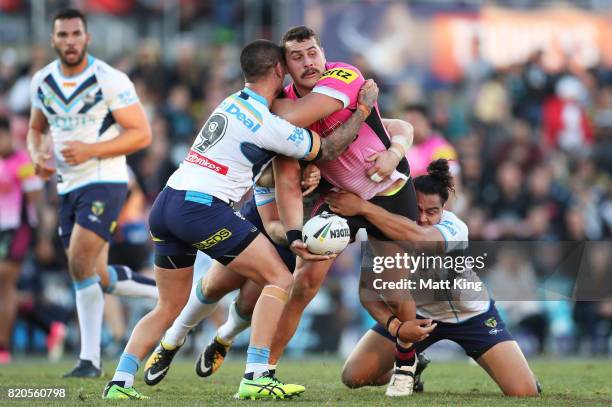 Reagan Campbell-Gillard of the Panthers is tackled during the round 20 NRL match between the Penrith Panthers and the Gold Coast Titans at Pepper...