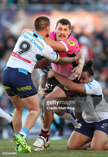 Reagan Campbell-Gillard of the Panthers is tackled during the round 20 NRL match between the Penrith Panthers and the Gold Coast Titans at Pepper...
