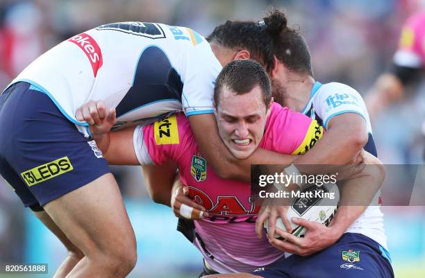 Isaah Yeo of the Panthers is tackled during the round 20 NRL match between the Penrith Panthers and the Gold Coast Titans at Pepper Stadium on July...