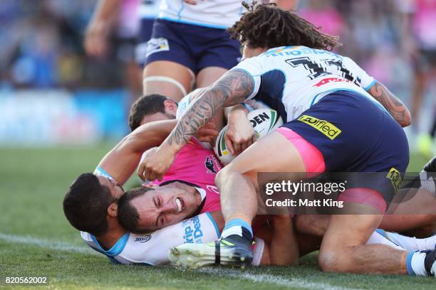 Isaah Yeo of the Panthers is held up just short of the line during the round 20 NRL match between the Penrith Panthers and the Gold Coast Titans at...