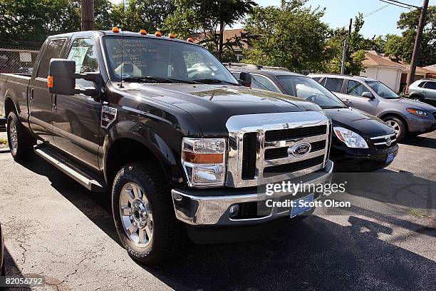 Ford F250 truck sits in a dealership's storage lot July 24, 2008 in Chicago, Illinois. Ford Motor Co. Today posted second quarter losses of $8.7...