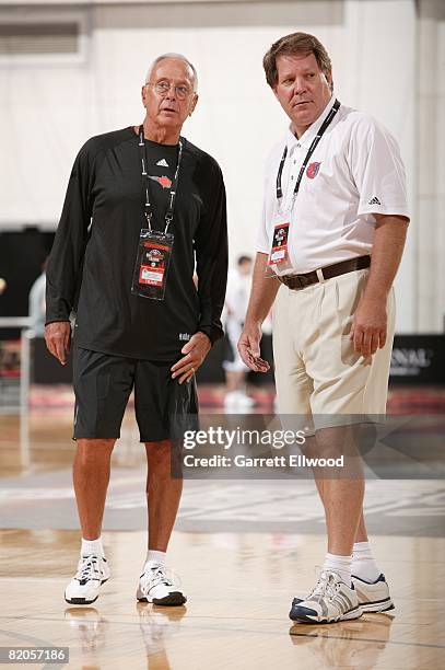 Head coach Larry Brown and assistant coach Dave Hanners of the Charlotte Bobcats talk on the court prior to the game against the New Orleans Hornets...