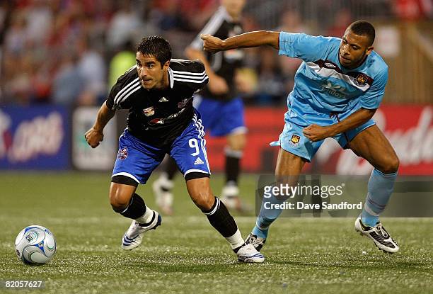 Forward Juan Pablo Angel of New York Red Bulls keeps the ball from defender Anton Ferdinand during the 2008 Pepsi MLS All Star Game between the MLS...