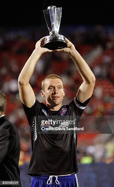 Team captain Jimmy Conrad holds the winners trophy during the 2008 Pepsi MLS All Star Game between the MLS All Stars and West Ham United at BMO Field...