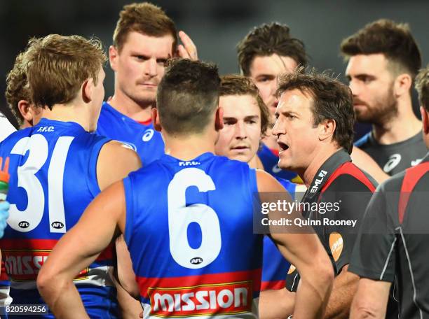 Bulldogs head coach Luke Beveridge talks to his players during the round 18 AFL match between the Western Bulldogs and the Gold Coast Suns at...