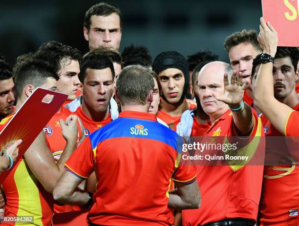 Suns head coach Rodney Eade talks to his players during the round 18 AFL match between the Western Bulldogs and the Gold Coast Suns at Cazaly's...