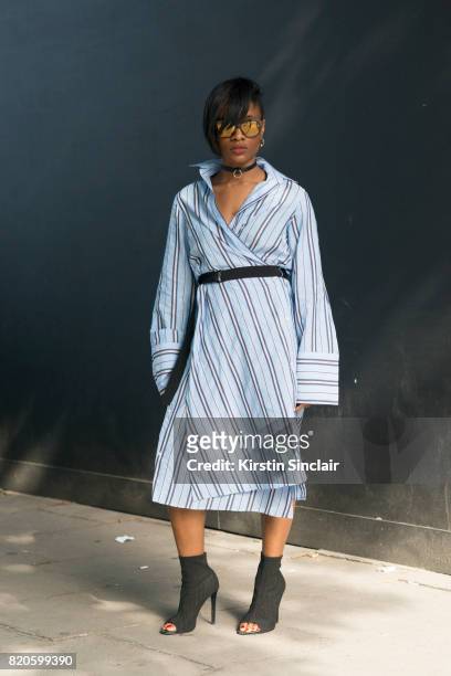 Stylist Erika Vendette wears an H and M dress and choker, Aldo shoes and Etnia Barcelona sunglasses on day 3 of London Collections: Men on June 11,...