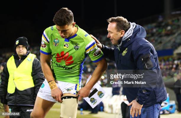 Raiders coach Ricky Stuart talks with Joseph Tapine of the Raiders during the round 20 NRL match between the Canberra Raiders and the Melbourne Storm...