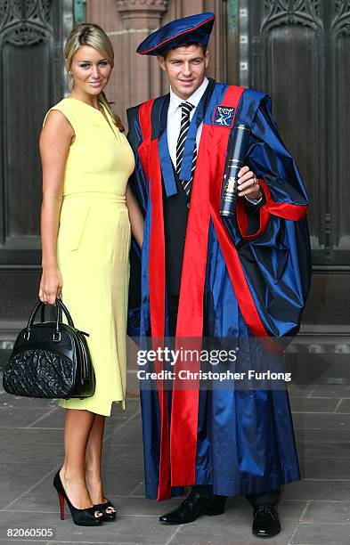 Liverpool FC captain Steven Gerrard poses with his wife Alex Curran after collecting his Honorary Fellowship from Liverpool John Moores University on...