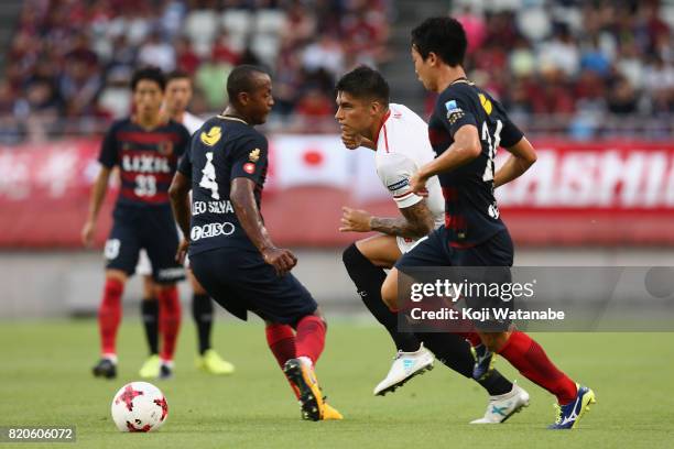 Joaquin Correa of Sevilla controls the ball under pressure of Leo Silva and Yukitoshi Ito of Kashima Antlers during the preseason friendly match...