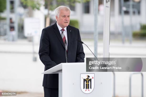 Bavarian Governor Horst Seehofer speaks at an event to commemorate the first anniversary of the shooting spree that one year ago left ten people...