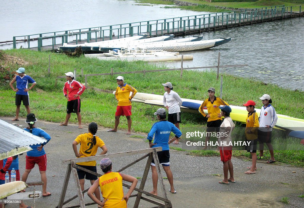 Athletes are seen warming up at the Myan