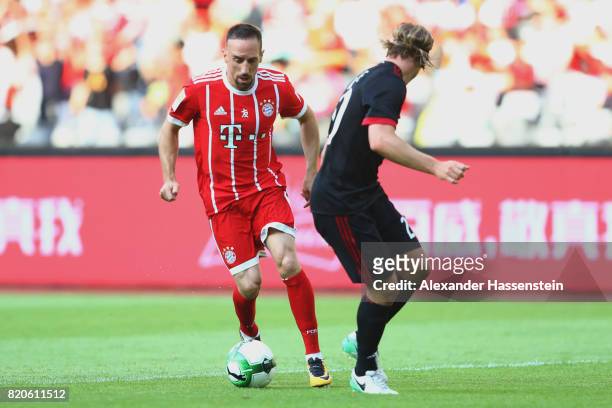 Franck Ribery of Muenchen battles for the ball with Gabriel Paletta of Milan during the International Champions Cup Shenzen 2017 match between Bayern...