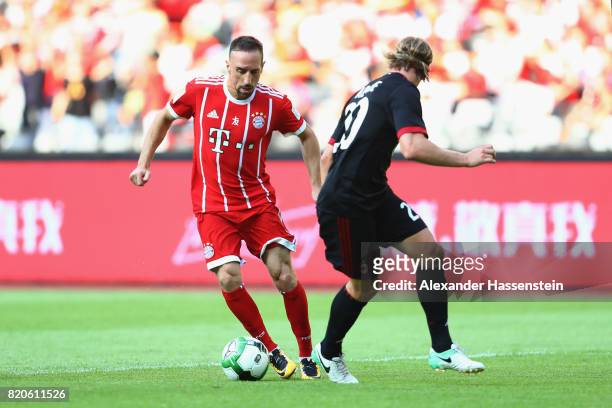Franck Ribery of Muenchen battles for the ball with Gabriel Paletta of Milan during the International Champions Cup Shenzen 2017 match between Bayern...