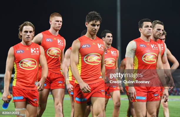 The Suns look dejected after losing the round 18 AFL match between the Western Bulldogs and the Gold Coast Suns at Cazaly's Stadium on July 22, 2017...