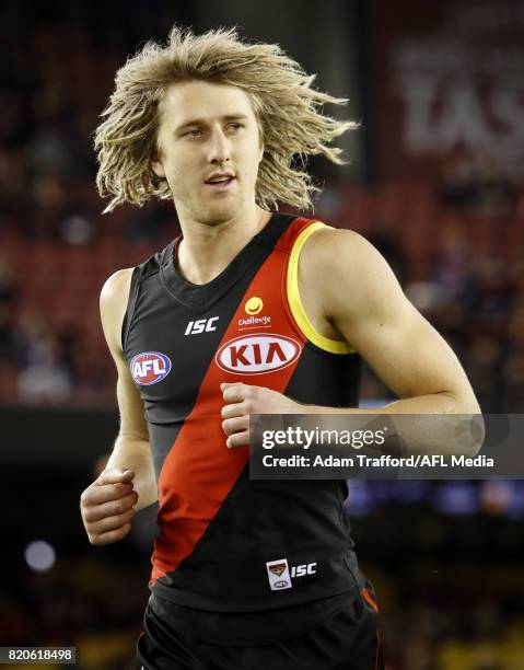 Dyson Heppell of the Bombers is seen with a yellow armband in support of children's cancer charity 'Challenge' ahead of the Clash for Cancer during...