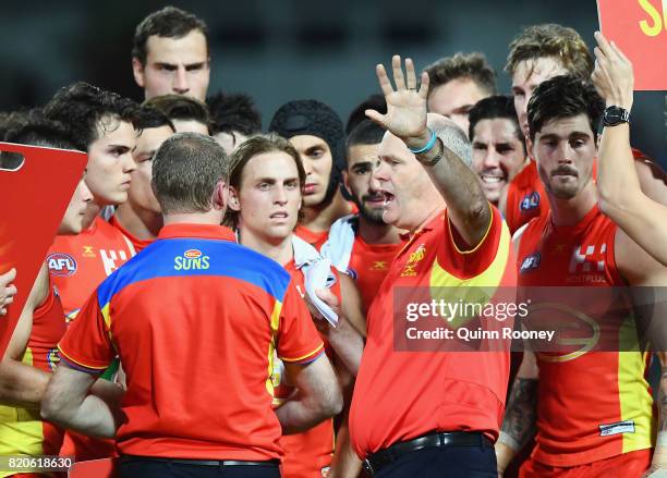 Suns head coach Rodney Eade talks to his players during the round 18 AFL match between the Western Bulldogs and the Gold Coast Suns at Cazaly's...