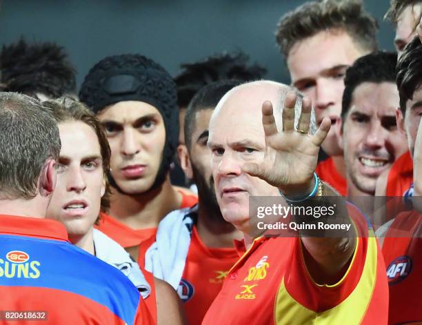 Suns head coach Rodney Eade talks to his players during the round 18 AFL match between the Western Bulldogs and the Gold Coast Suns at Cazaly's...