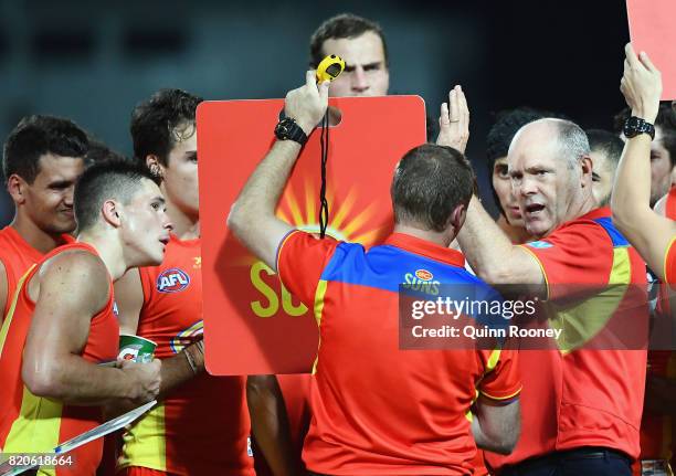 Suns head coach Rodney Eade talks to his players during the round 18 AFL match between the Western Bulldogs and the Gold Coast Suns at Cazaly's...