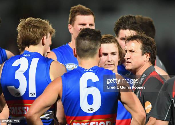 Bulldogs head coach Luke Beveridge talks to his players during the round 18 AFL match between the Western Bulldogs and the Gold Coast Suns at...