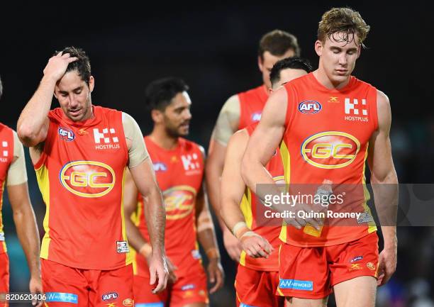The Suns look dejected after losing the round 18 AFL match between the Western Bulldogs and the Gold Coast Suns at Cazaly's Stadium on July 22, 2017...