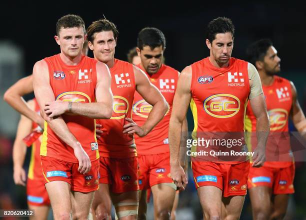 The Suns look dejected after losing the round 18 AFL match between the Western Bulldogs and the Gold Coast Suns at Cazaly's Stadium on July 22, 2017...