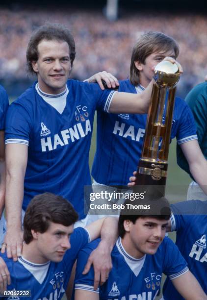 Everton's Andy Gray, Gary Stevens, Kevin Sheedy and Graeme Sharp with the Canon First Division Championship trophy after the presentation prior to...