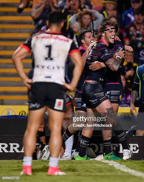 Ethan Lowe of the Cowboys celebrates after scoring a try during the round 20 NRL match between the North Queensland Cowboys and the New Zealand...