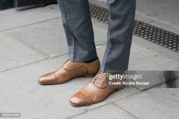 Model Sam Harwood wears Christian Louboutin shoes and a Ben Sherman suit on day 3 of London Collections: Men on June 12, 2017 in Paris, France.